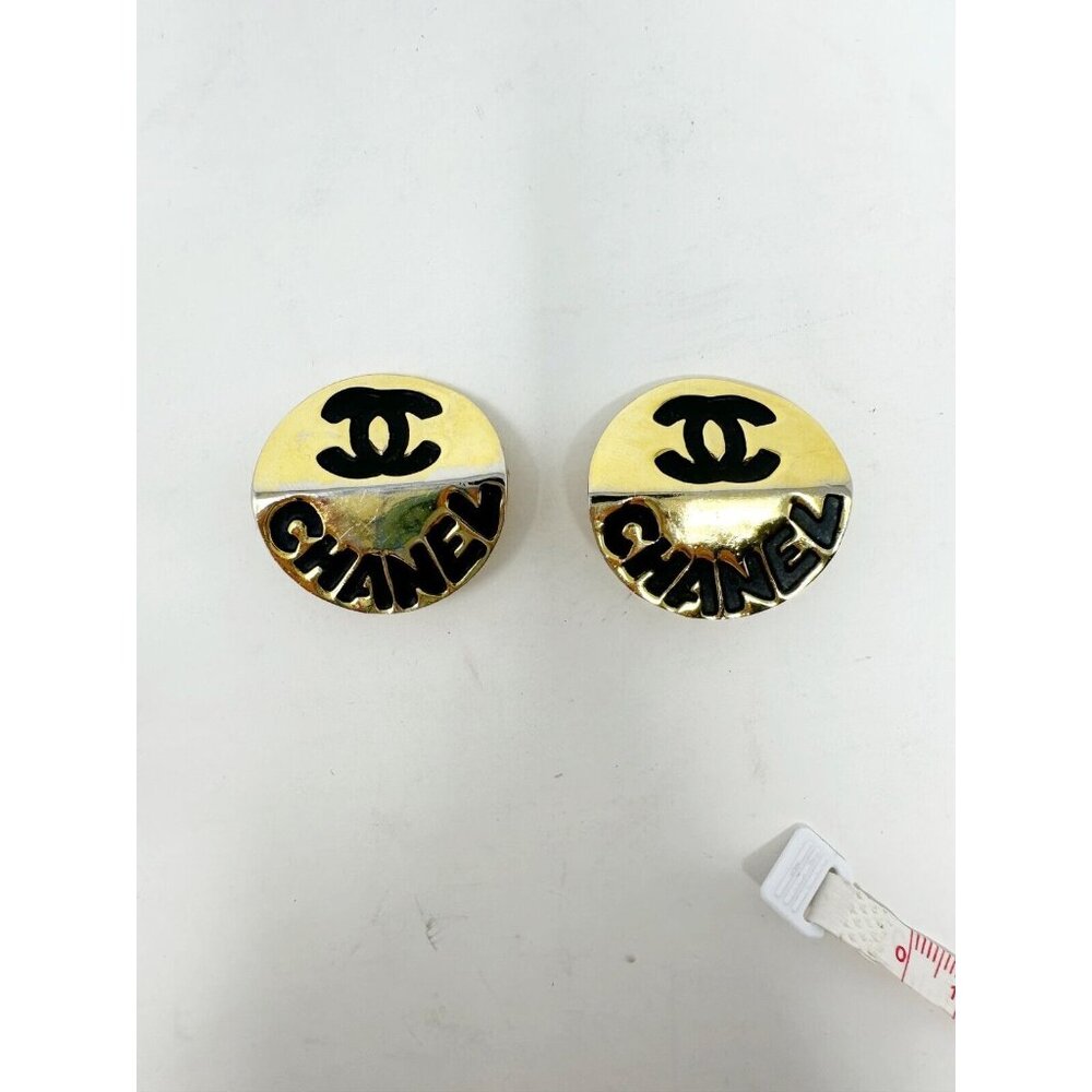 Chanel Pair of Gold Plated Black Metal Clip On Earrings Interlocked C Logo Round